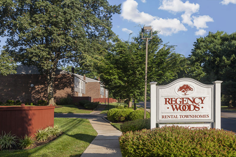 Entrance sign to Regency Woods apartments in Doylestown, PA